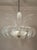 Venetian chandelier from the 1930s, crafted in the Ercole Barovier furnaces, with a distinctive floral structure in clear...