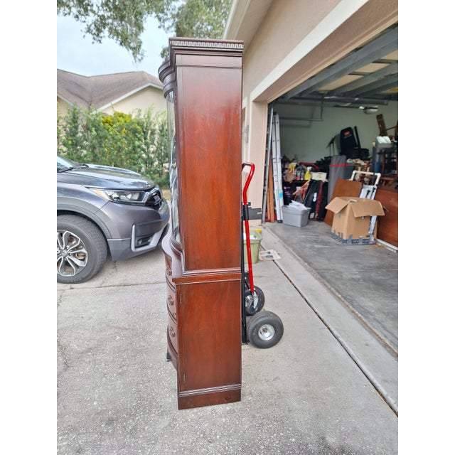 Add timeless elegance to your home with this beautiful mid-century china cabinet from Drexel’s New Travis Court...