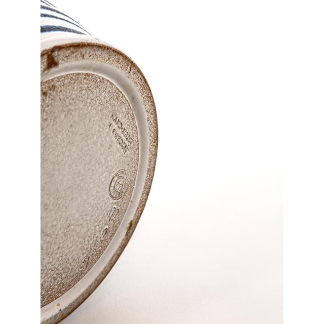 A highly decorative Swedish stoneware vase produced by Höganäs Keramik during the mid-20th century, featuring bold hand-...