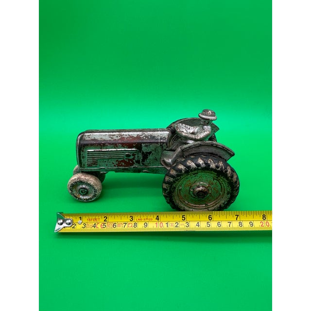 Wonderful antique Arcade cast-iron Oliver 70 Row Crop farm tractor toy, dating to approximately the late 1930s or early...