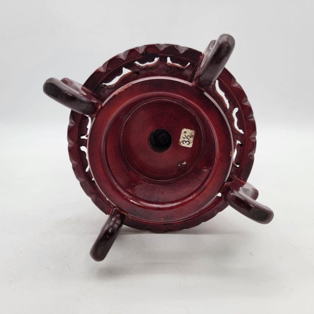 This French metal vase exudes antique charm with its ornate floral motifs and cherub design. Set on a marble base with a...