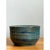 This pottery bowl presents a classic, gently rounded form, its cylindrical walls sloping outward slightly from base to...