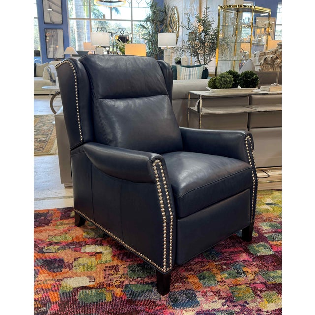 A pair of beautiful navy blue leather recliners by Hancock & Moore. These manual recliners offer a plump and supportive...