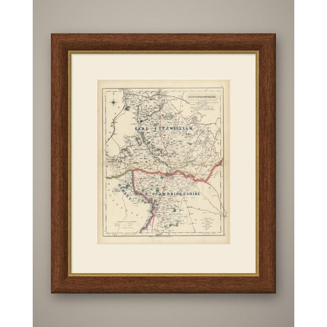 Hand coloured to show three hunt countries, this antique fox hunting map of Huntingdonshire was engraved by J. and C....