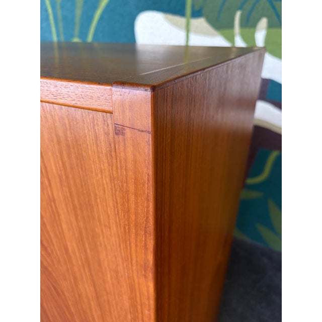 Danish modern cabinet that provides ample storage and an easy solution to organization. All doors and drawers open and...