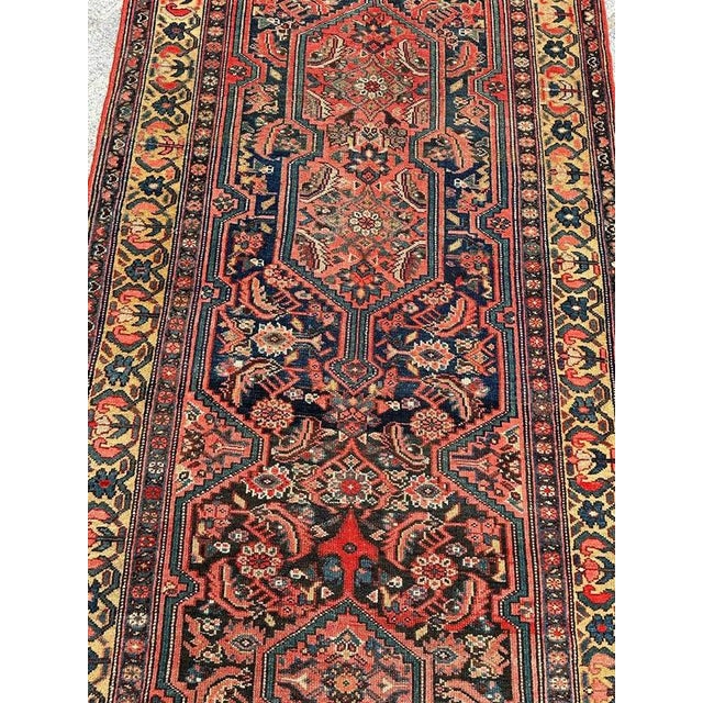 Very beautiful late 19th century malayer runner with a beautiful large herati design with stylized designs inside a...
