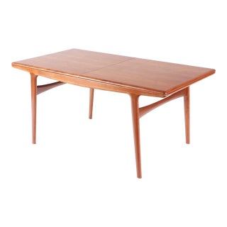 A Johannes Andersen Mid Century Modern Teak Dining Table With Built in Leaves Circa 1960 For Sale