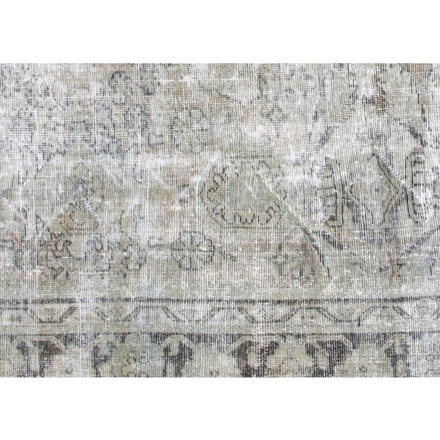 This substantial vintage Mahal rug originates from Iran's Mahal region, measuring 8'11" x 12' and representing centuries...