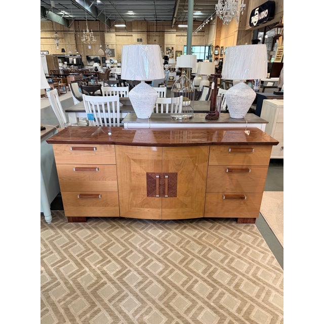 A striking Italian credenza that masterfully blends Mid Century Modern restraint with the bold geometry of Art Deco...