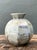 Vintage Studio Pottery Ceramic Vase with a rounded, bulbous body, slightly flared neck, and understated vertical ridges...