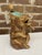 The majolica pitcher is a seated, cross-legged brown bear holding a spoon with a bright blue interior. The handle is...
