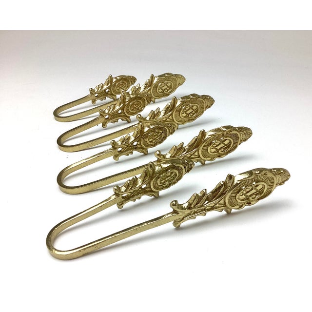 Vintage set of 4 Brass Tie Backs.. 6 1/2“ x one and 1/2“ x 2“ They are in wonderful gently used age-appropriate condition.