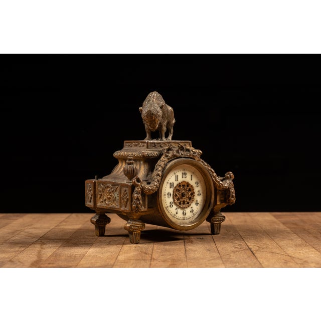 c. 1900s; The New Haven Clock Co. - New Haven, CT Antique gilded mantle clock with raised, dimensional embellishments and...