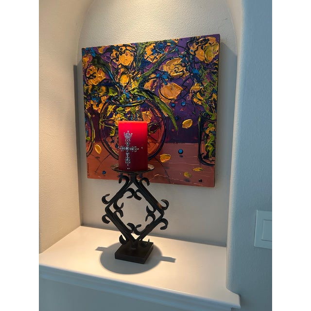 Vintage hand-forged iron pillar candle holder Made in Mexico. Decorative curled ironwork with raised candle plate. Made in...