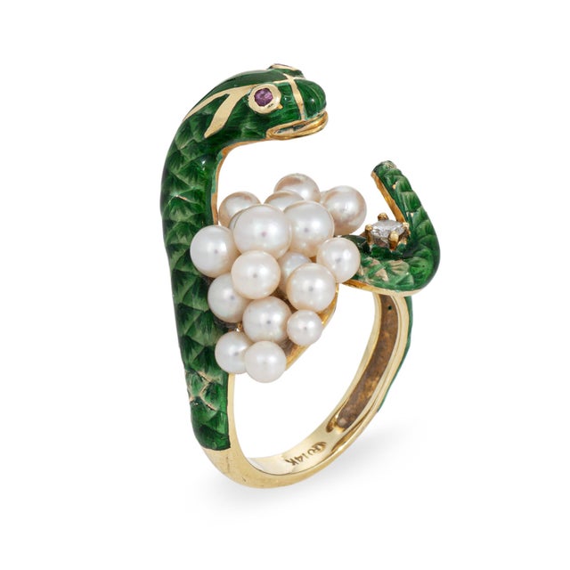 Finely detailed vintage snake ring crafted in 14 karat yellow gold (circa 1970s). Cultured pearls measure from 2.5mm to...