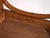 A set of four antique chairs in bentwood, with a curved crest rail over vertical splats and a moulded board seat....