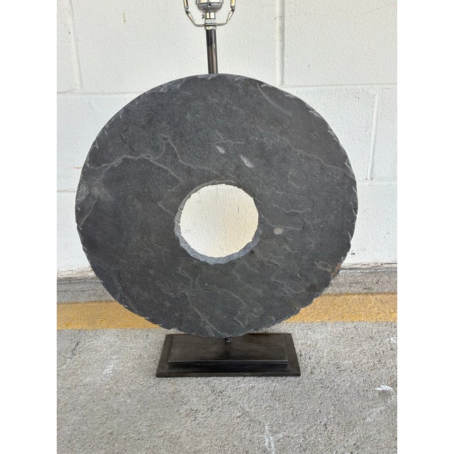 Stylish Arteriors Carved Slate Ring Lamp. Large carved slate ring body on black metal base. Showroom floor sample.