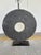 Stylish Arteriors Carved Slate Ring Lamp. Large carved slate ring body on black metal base. Showroom floor sample.