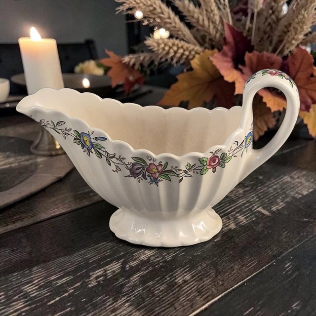 The Vintage Spode Copeland England Felicity Floral Pattern Gravy Boat is a charming and elegant piece of stoneware from...