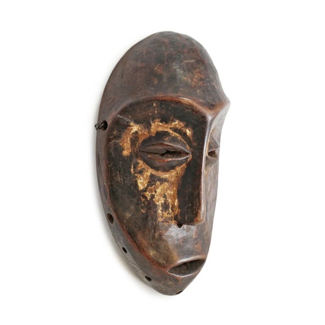 Vintage Lega mask from Democratic Republic of Congo. Traditional stylized features and beautiful signs of age and use....