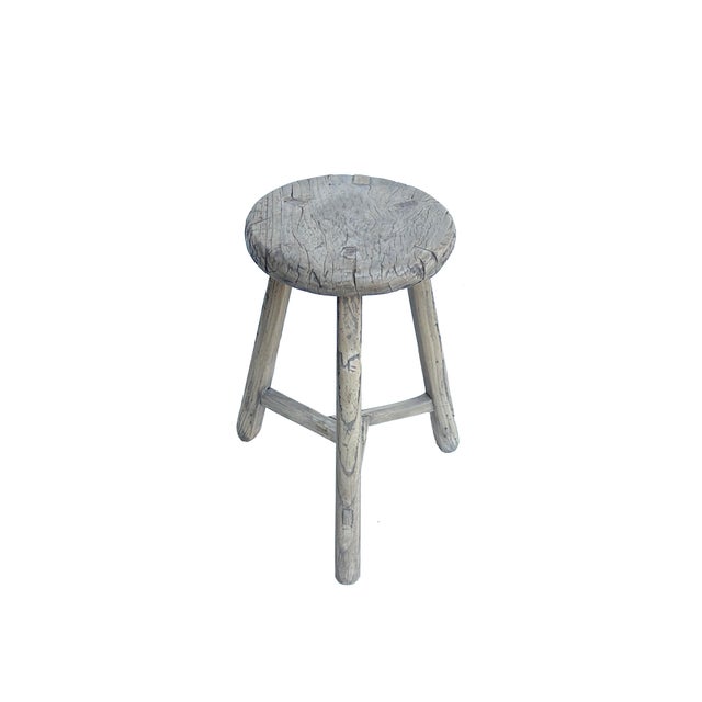 This is a rustic, handcrafted wooden stool featuring a simple yet sturdy design that exudes timeless charm. The stool has...