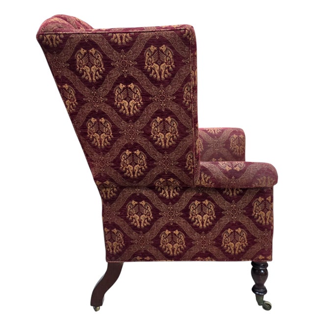 This Georgian Revival wingback chair is elegant in deep burgundy has a commanding traditional profile and is a classically...