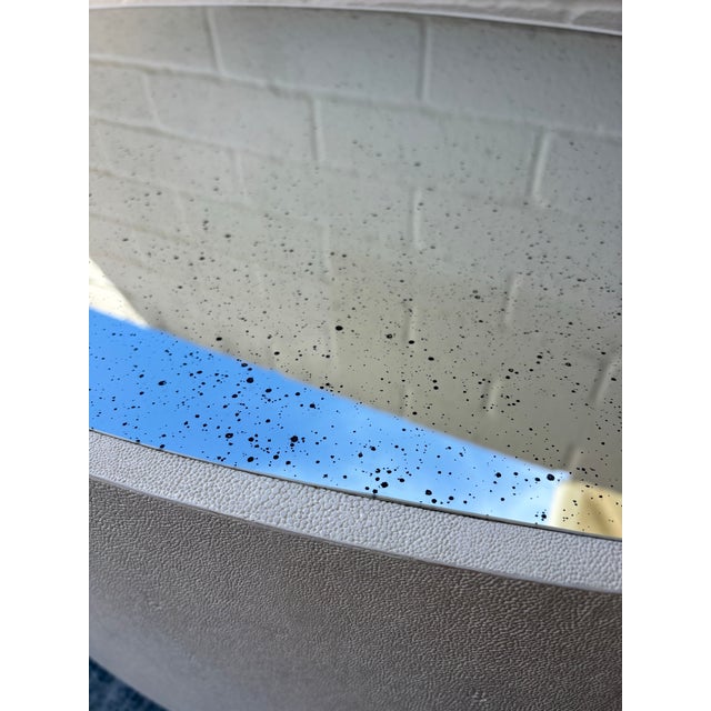 Cara Oval Coffee Table by Made Goods. White faux shagreen (imitation stingray skin) body and is topped with an antiqued /...