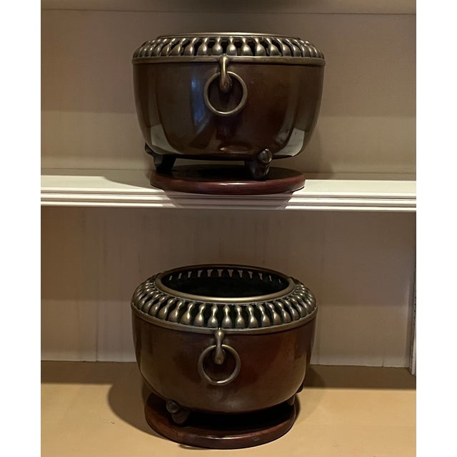 Pair antique Japanese Art Deco Taisho bronze cachepot planters or orchid pots, circa 1920. Each with loose ring handles at...
