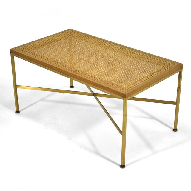 This lovely model 7709 Paul McCobb bench is light and elegant. The brass base with its X-shaped stretchers supports a...