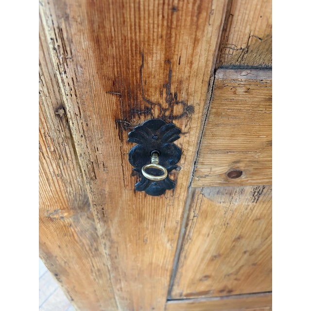Up for sale in Sunapee Harbor is a unique Antique European Scrubbed Pine Pantry Cupboard with a raised panel door and has...