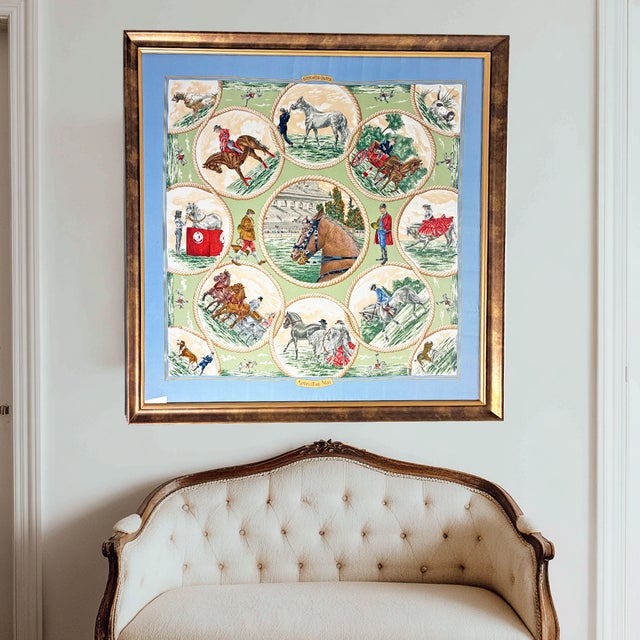 A magnificent and rare framed Hermès Paris silk scarf featuring the iconic "Auteuil en Mai" design — a richly detailed...