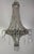 This refined Empire-style chandelier exudes understated opulence with its graceful silhouette and cascading strands of...