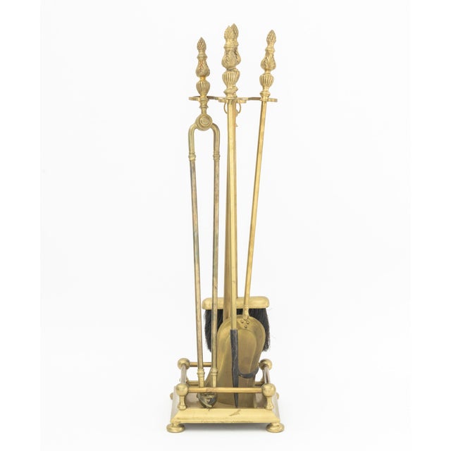Neoclassical Style Brass Five-Piece Fireplace Tools Set, comprising: shovel, pair of tongs, broom, poker, and stand....
