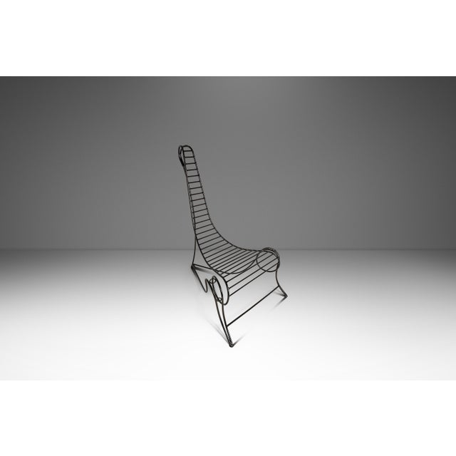 Introducing a hand-forged and welded sculptural wrought iron chair designed and crafted after the iconic "Spine Chair" by...