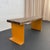 This vintage industrial bench or coffee table pairs a heavy-duty architectural foundation with organic, time-earned...