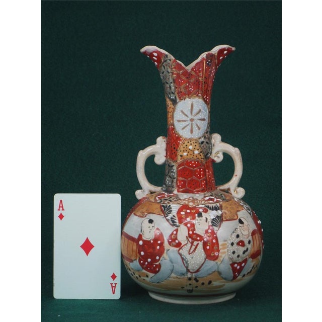 This antique Japanese Satsuma figurine vase with handles is a stunning piece of Oriental pottery originating from Japan in...