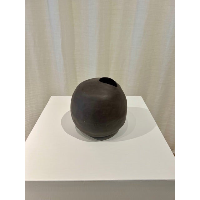 Dimensions: 6.5” diameter x 7”h Material: stoneware Finishing: unglazed Color: mushroom Edition: one-of-a-kind