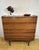 A beautifully designed mid-century teak bureau by meredew, dating from the 1960s, combining practicality with the clean,...