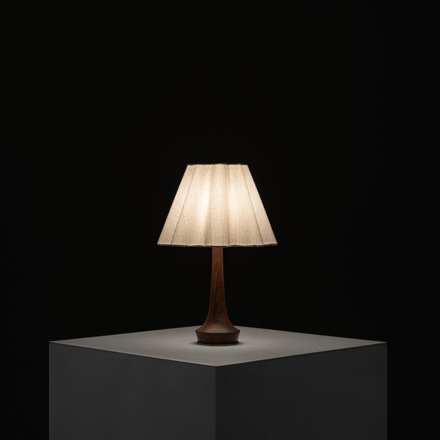 Defined by its elegant proportions and organic silhouette, this table lamp is a refined example of Danish design from the...