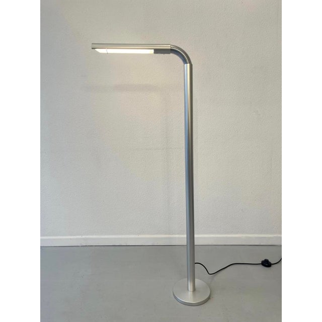 Attractive S1 adjustable floor lamp in brushed aluminum, manufactured by Baltensweiler AG in Switzerland around 1969. The...