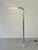 Attractive S1 adjustable floor lamp in brushed aluminum, manufactured by Baltensweiler AG in Switzerland around 1969. The...