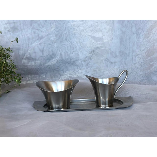 Selandia Denmark's sleek modern designs never go out of style. This vintage 1960s stainless steel sugar bowl and milk...