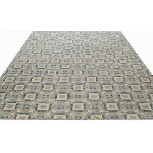 ACTUAL SIZE: 9’1″ x 11’10” PRIMARY COLOR: Beige / Green AGE: New ORIGIN: India MATERIALS: Wool FOUNDATION: Cotton...