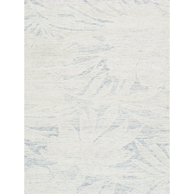 Bring a fresh, relaxed feel to your space with this beautiful hand-tufted rug featuring an elegant palm leaf design in...
