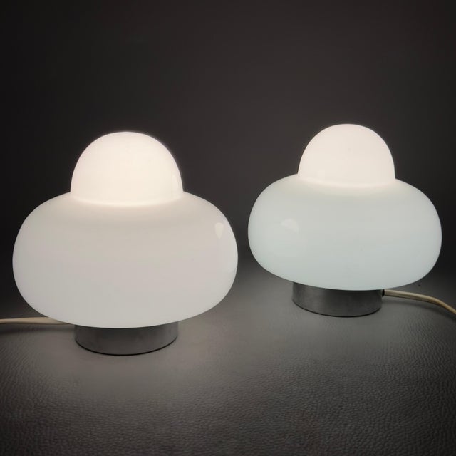This exceptional pair of table lamps represents a timeless classic of 1970s Space Age design. Their rarity lies in their...