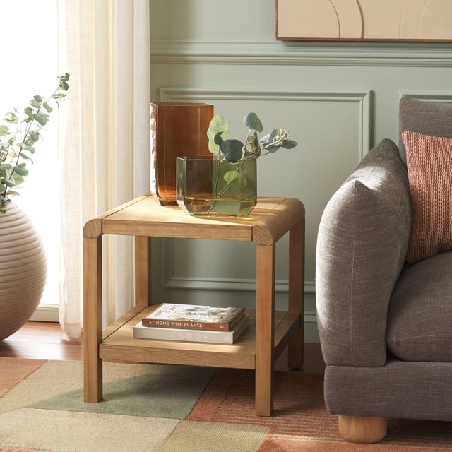 Introducing the OMARA 1 Shelf Side Table in a natural finish, a perfect addition to your living space. This beautifully...