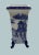Chinoiserie Vase with Pagoda Scene and Sculptural Feet A rare square-mouthed porcelain vase rendered in classic blue-and-...