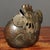 This unique piece is sculpted in the form of a plump, stylized rooster, featuring a prominent comb, a curled tail, and a...