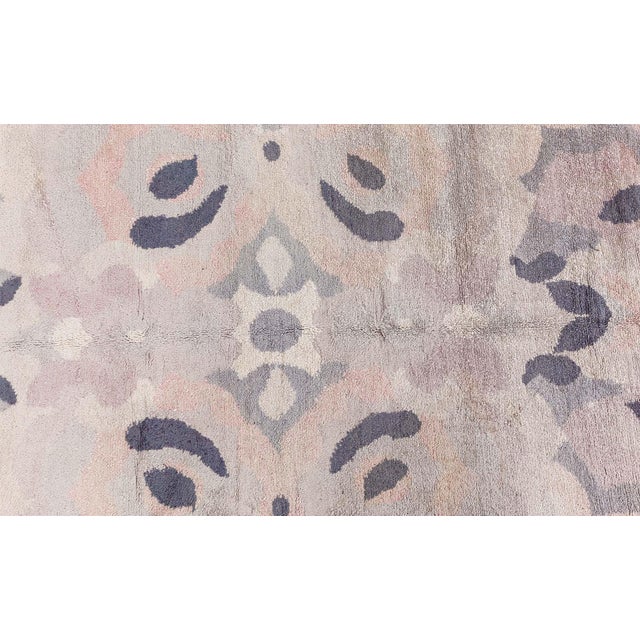 A stunning example of mid-20th-century French textile artistry, this circa 1945 French Deco Art Nouveau rug presents a...