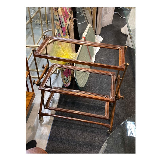 A refined and highly collectible mid-century modern bar cart produced in Italy during the 1950s. This elegant trolley...